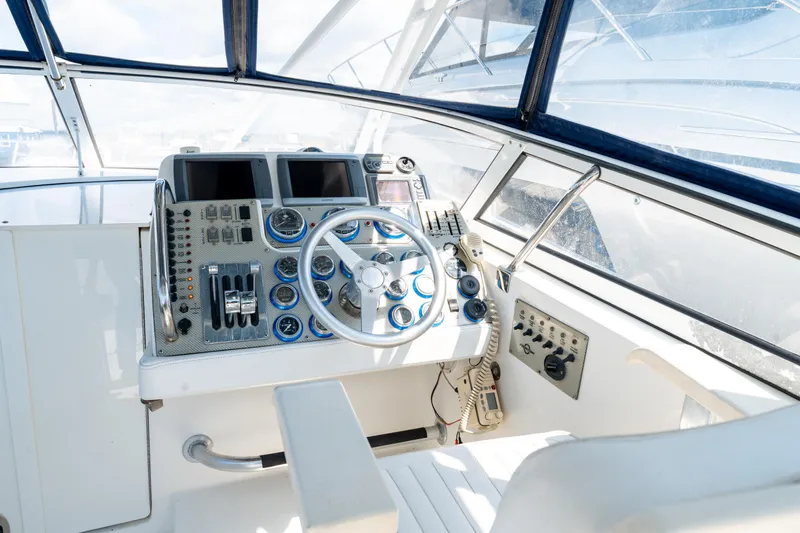  Yacht Photos Pics 2008 Fountain 38 Sportfish Cruiser helm with modern controls and navigation equipment.