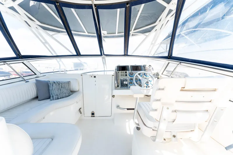  Yacht Photos Pics 2008 Fountain 38 Sportfish Cruiser cockpit with white seating and modern controls.