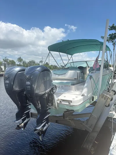 Yacht Photos Pics 2022 Robalo R317 Dual Console boat with twin Yamaha 300 engines on a lift.