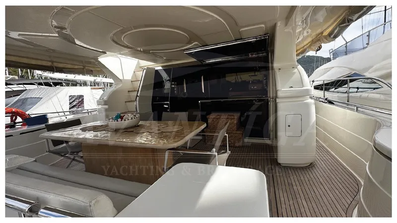  Yacht Photos Pics Luxurious 2003 Ferretti Yachts 680 interior with elegant seating and dining area.