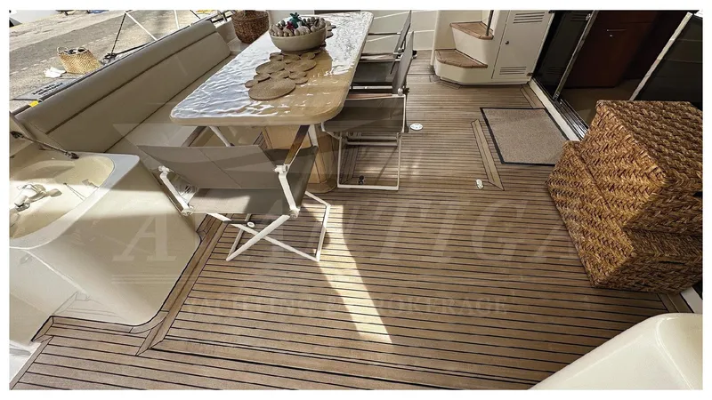  Yacht Photos Pics Luxurious 2003 Ferretti Yachts 680 deck with elegant seating and dining area.