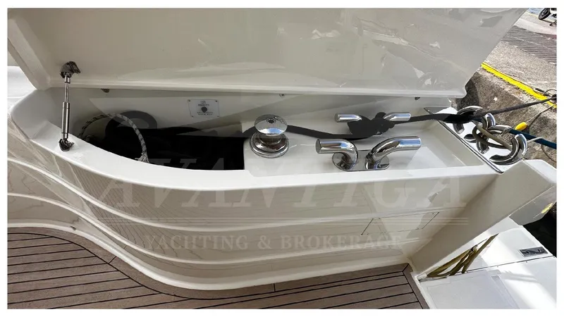  Yacht Photos Pics Open storage compartment on 2003 Ferretti Yachts 680, featuring winch and cleats.
