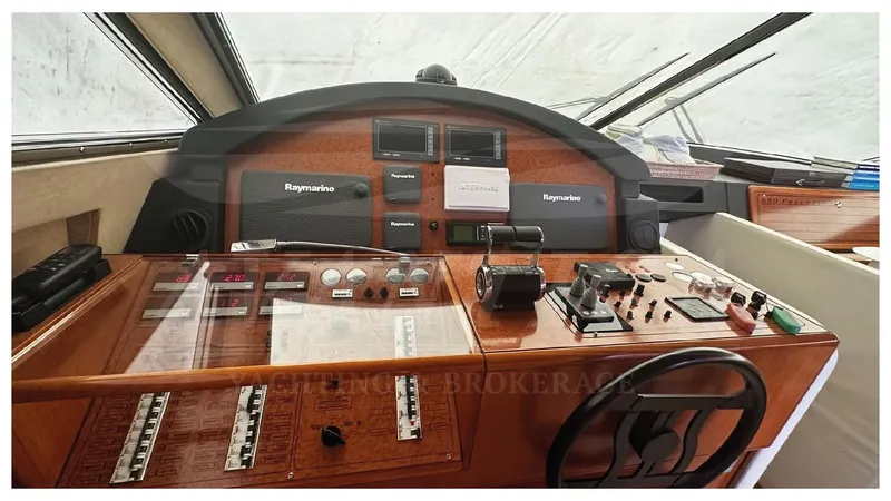  Yacht Photos Pics Helm of 2003 Ferretti Yachts 680 with navigation equipment and controls.