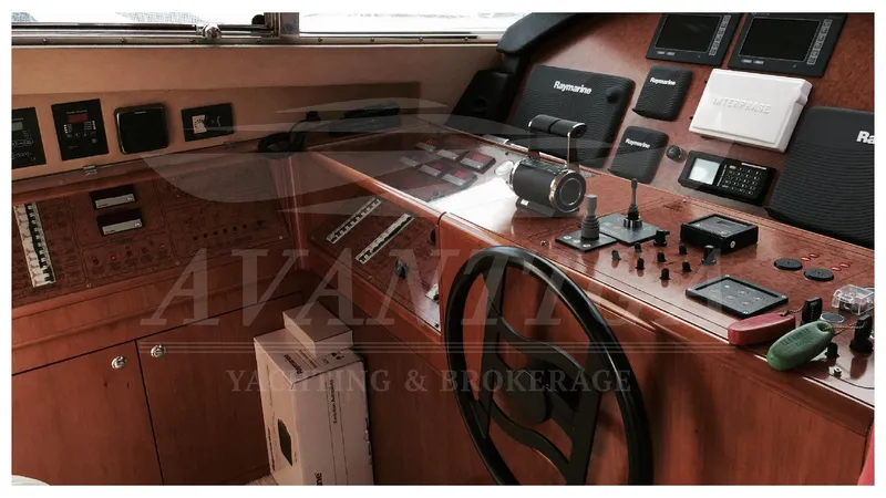  Yacht Photos Pics Cockpit of 2003 Ferretti Yachts 680 with navigation instruments and controls.