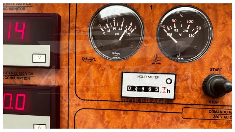  Yacht Photos Pics Control panel of a 2003 Ferretti Yachts 680, featuring gauges and hour meter.
