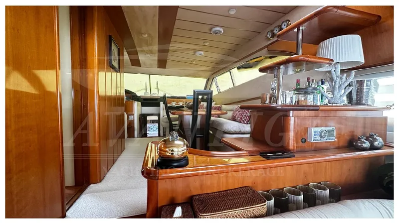  Yacht Photos Pics Luxurious interior of 2003 Ferretti Yachts 680 with elegant wood finishes and modern amenities.