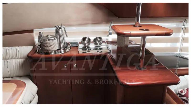  Yacht Photos Pics Luxurious interior of 2003 Ferretti Yachts 680 with elegant wood finishes and modern amenities.
