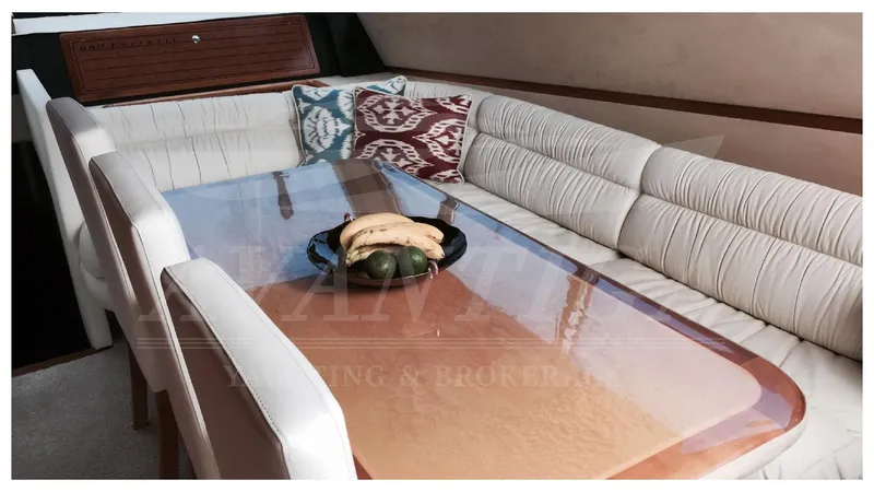  Yacht Photos Pics Luxurious interior of 2003 Ferretti Yachts 680 with elegant dining area and plush seating.