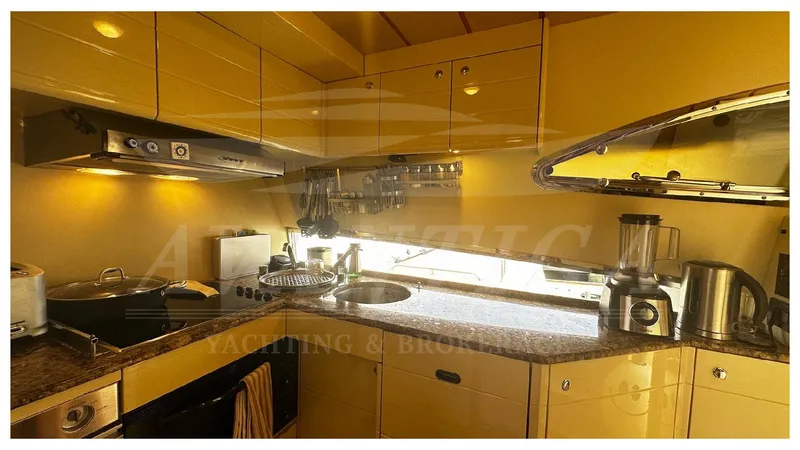  Yacht Photos Pics Luxurious kitchen interior of 2003 Ferretti Yachts 680 with modern appliances.