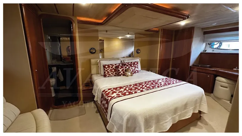  Yacht Photos Pics Luxurious bedroom interior of 2003 Ferretti Yachts 680 with elegant bedding and wood finishes.