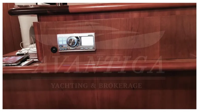  Yacht Photos Pics Interior of 2003 Ferretti Yachts 680 with wooden panel and audio system.