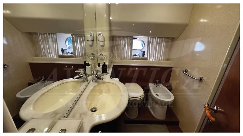  Yacht Photos Pics Luxurious bathroom in 2003 Ferretti Yachts 680 with double sinks and modern fixtures.