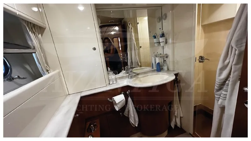  Yacht Photos Pics Luxurious bathroom in 2003 Ferretti Yachts 680 with elegant fixtures and ample storage.