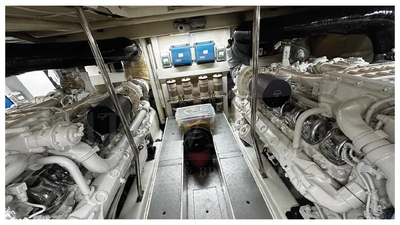  Yacht Photos Pics Engine room of 2003 Ferretti Yachts 680, showcasing dual engines and control systems.