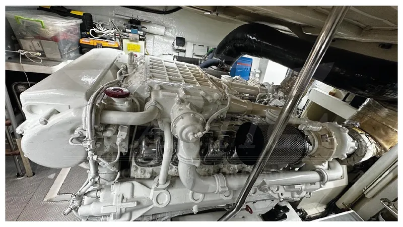  Yacht Photos Pics Engine room of a 2003 Ferretti Yachts 680, showcasing a powerful marine engine.