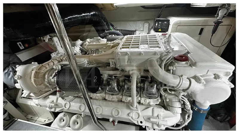  Yacht Photos Pics Engine room of a 2003 Ferretti Yachts 680, showcasing a powerful marine engine.