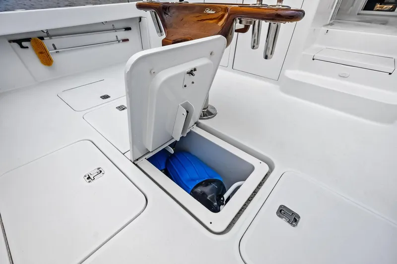 Urgent Sea Yacht Photos Pics 2003 Viking 45 Open boat deck with storage compartment and fishing rod holders.