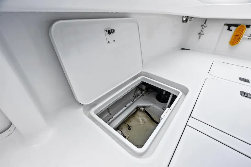 Urgent Sea Yacht Photos Pics Open hatch on 2003 Viking 45 Open boat deck, showing storage compartment.