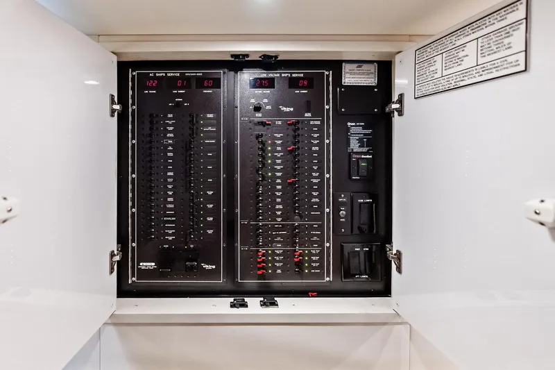 Urgent Sea Yacht Photos Pics Electrical panel inside a 2003 Viking 45 Open boat, featuring various switches and controls.