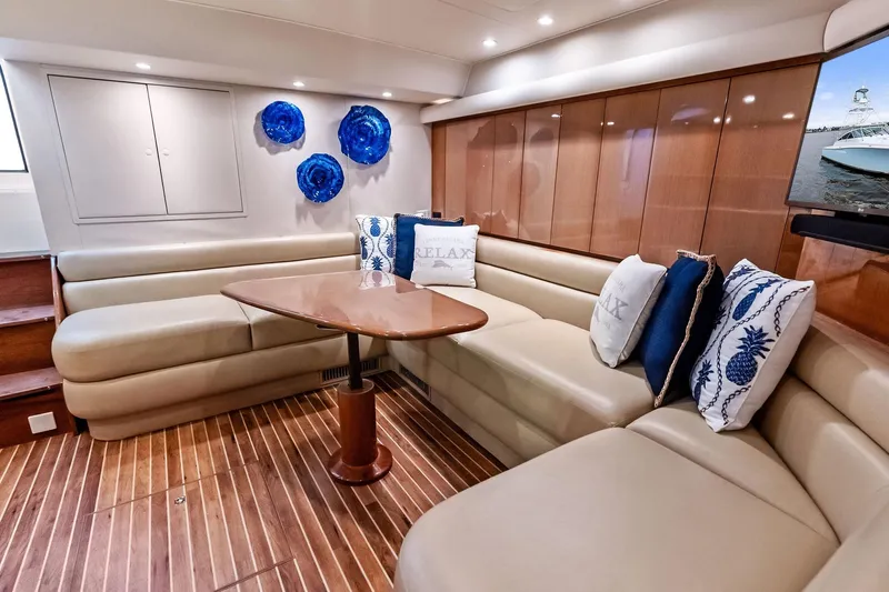 Urgent Sea Yacht Photos Pics Luxurious interior of 2003 Viking 45 Open yacht with elegant seating and decor.