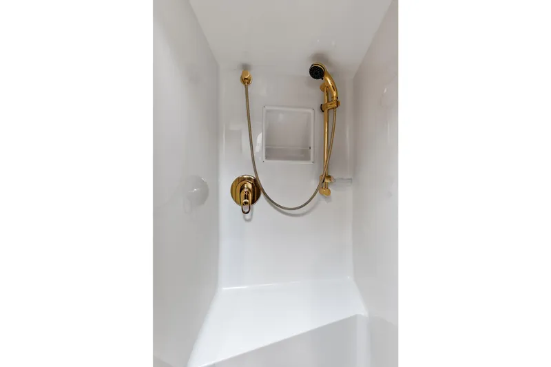 Urgent Sea Yacht Photos Pics Shower area with gold fixtures in 2003 Viking 45 Open boat.