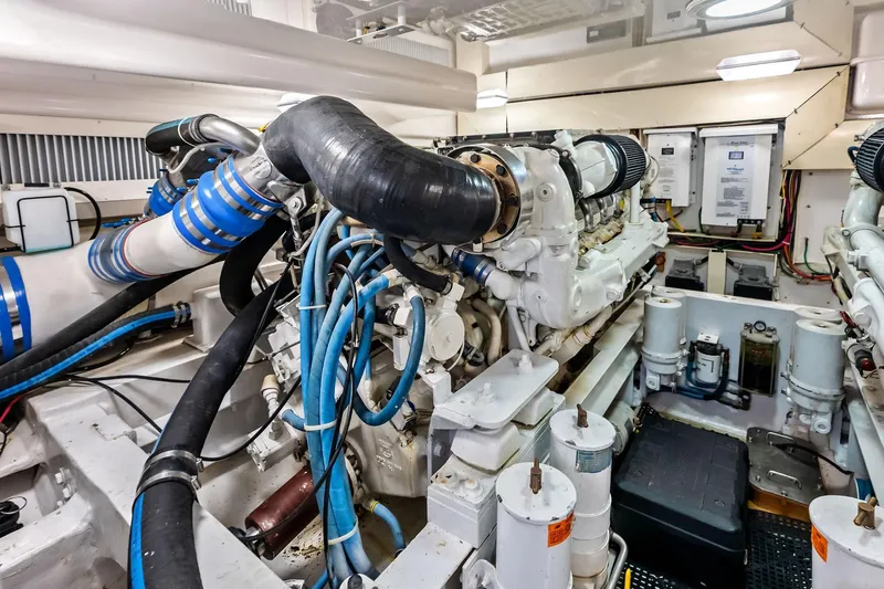 Urgent Sea Yacht Photos Pics Engine room of a 2003 Viking 45 Open yacht, showcasing complex machinery and wiring.