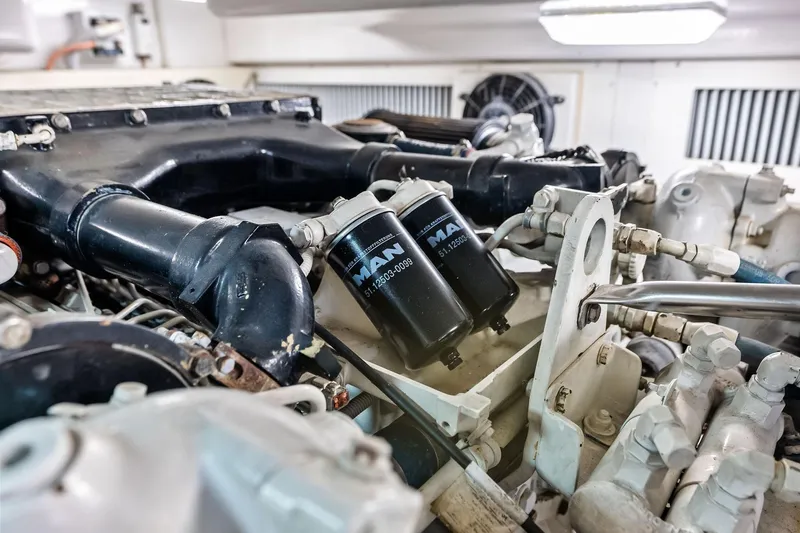 Urgent Sea Yacht Photos Pics Engine room of 2003 Viking 45 Open yacht, featuring MAN filters and components.