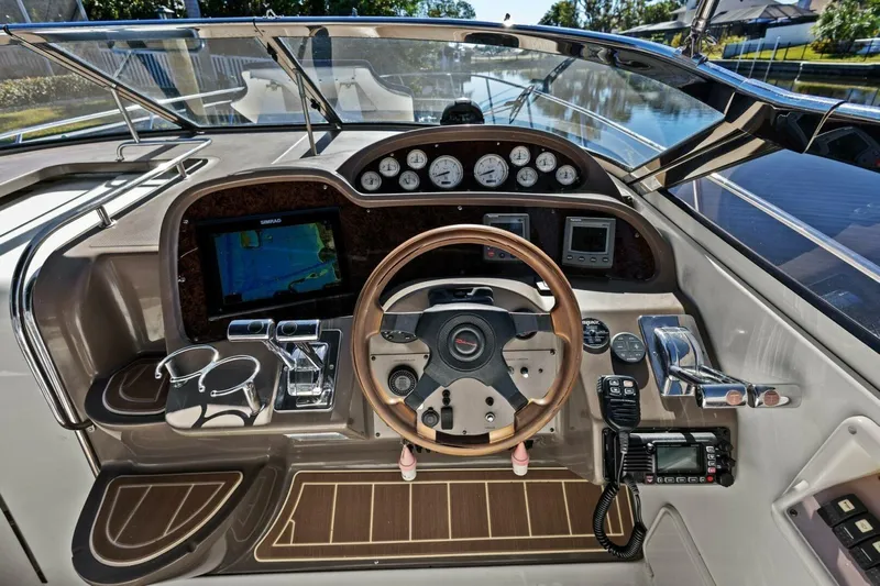 Yaeli Yacht Photos Pics 2005 Regal Commodore 3560 boat dashboard with steering wheel and navigation instruments.