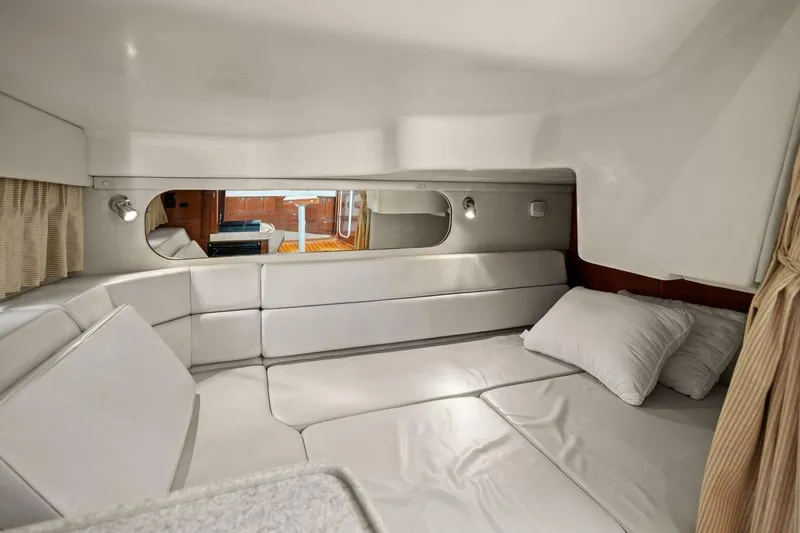 Yaeli Yacht Photos Pics 2005 Regal Commodore 3560 interior cabin with white leather seating and pillows.