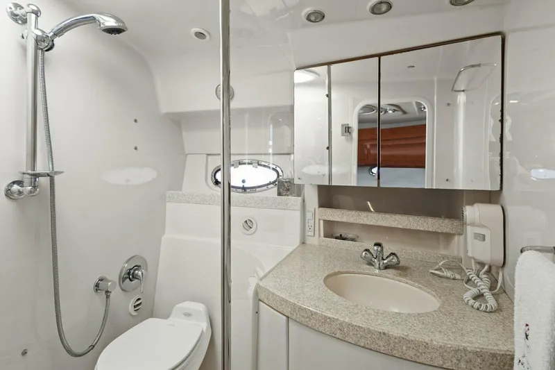 Yaeli Yacht Photos Pics Luxurious bathroom in 2005 Regal Commodore 3560 yacht with modern fixtures and elegant design.