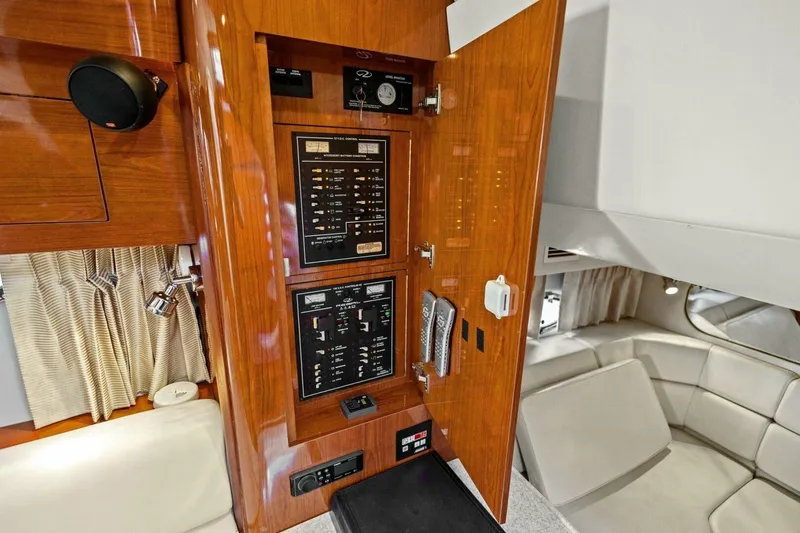 Yaeli Yacht Photos Pics 2005 Regal Commodore 3560 yacht interior with control panel and seating area.