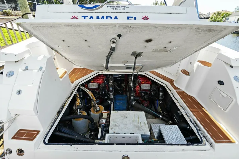 Yaeli Yacht Photos Pics 2005 Regal Commodore 3560 engine compartment with open hatch, showcasing mechanical components.