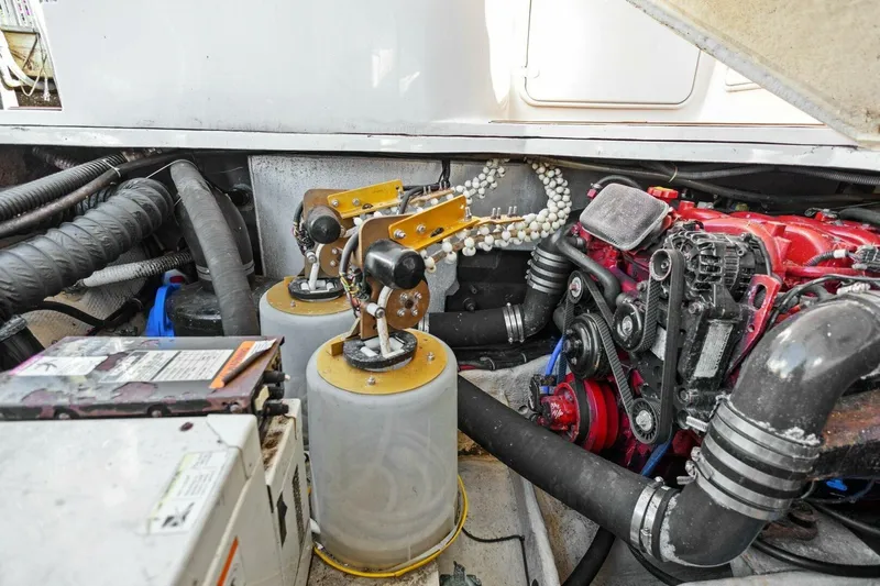 Yaeli Yacht Photos Pics Engine compartment of a 2005 Regal Commodore 3560 boat, showcasing mechanical components.