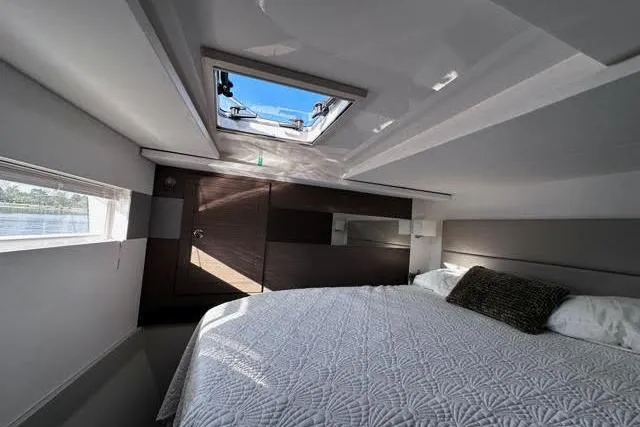 Wander Twins Yacht Photos Pics Luxurious cabin interior of 2023 Leopard 46 PC yacht with skylight and modern design.