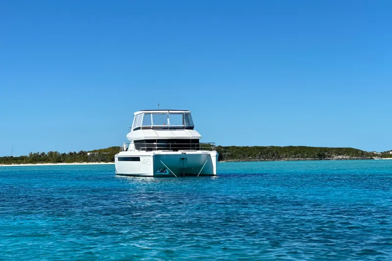 Wander Twins Yacht Photos Pics 2023 Leopard 46 PC yacht on clear blue water under a bright sky.