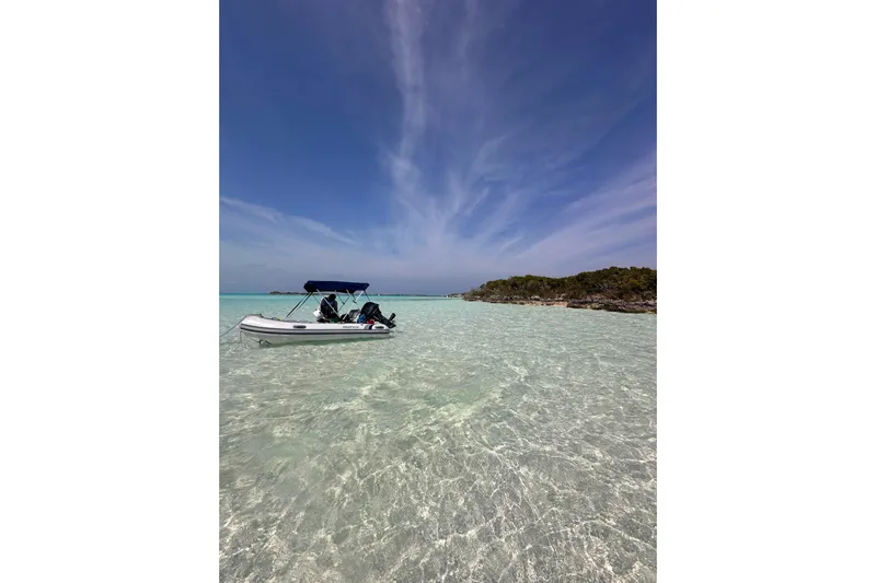Wander Twins Yacht Photos Pics A 2023 Leopard 46 PC boat on clear turquoise water under a blue sky.