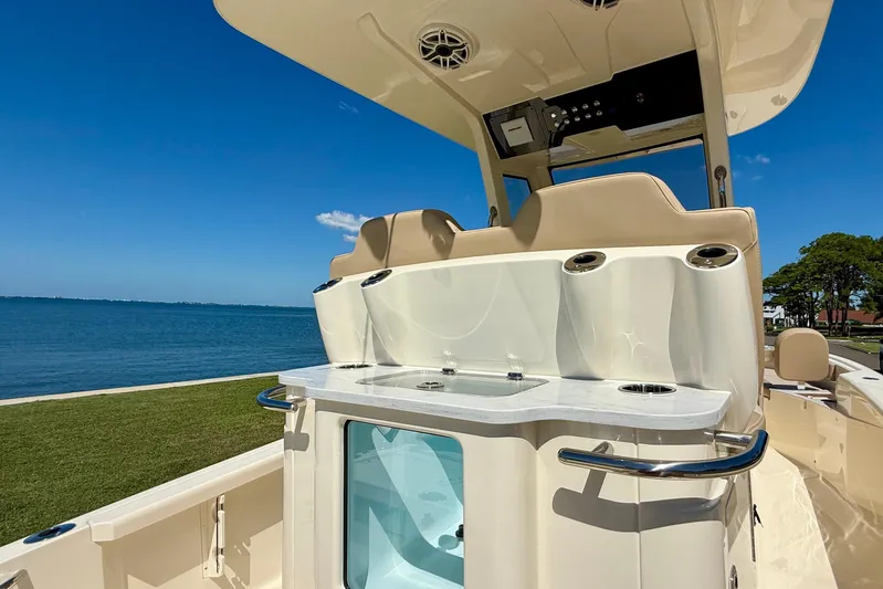  Yacht Photos Pics 2025 Scout 261 XSS boat interior with seating and ocean view.