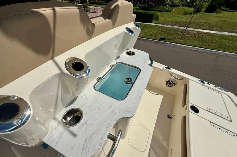  Yacht Photos Pics 2025 Scout 261 XSS boat interior with rod holders and storage compartments.