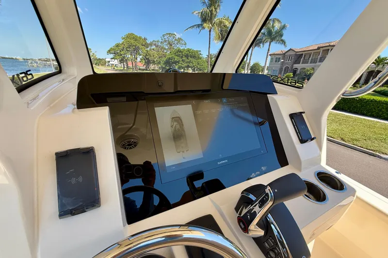 Yacht Photos Pics 2025 Scout 261 XSS boat dashboard with touchscreen display and control panel.