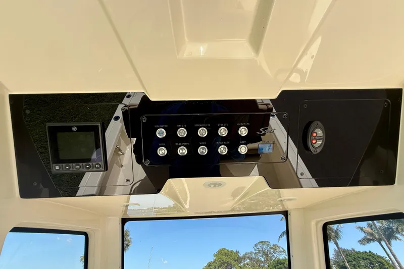  Yacht Photos Pics Control panel of 2025 Scout 261 XSS boat with various switches and display.