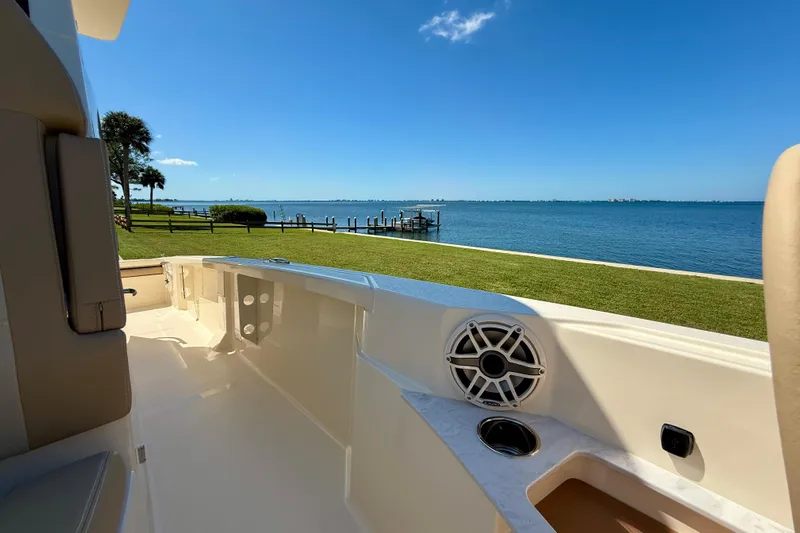  Yacht Photos Pics 2025 Scout 261 XSS boat interior with scenic waterfront view.