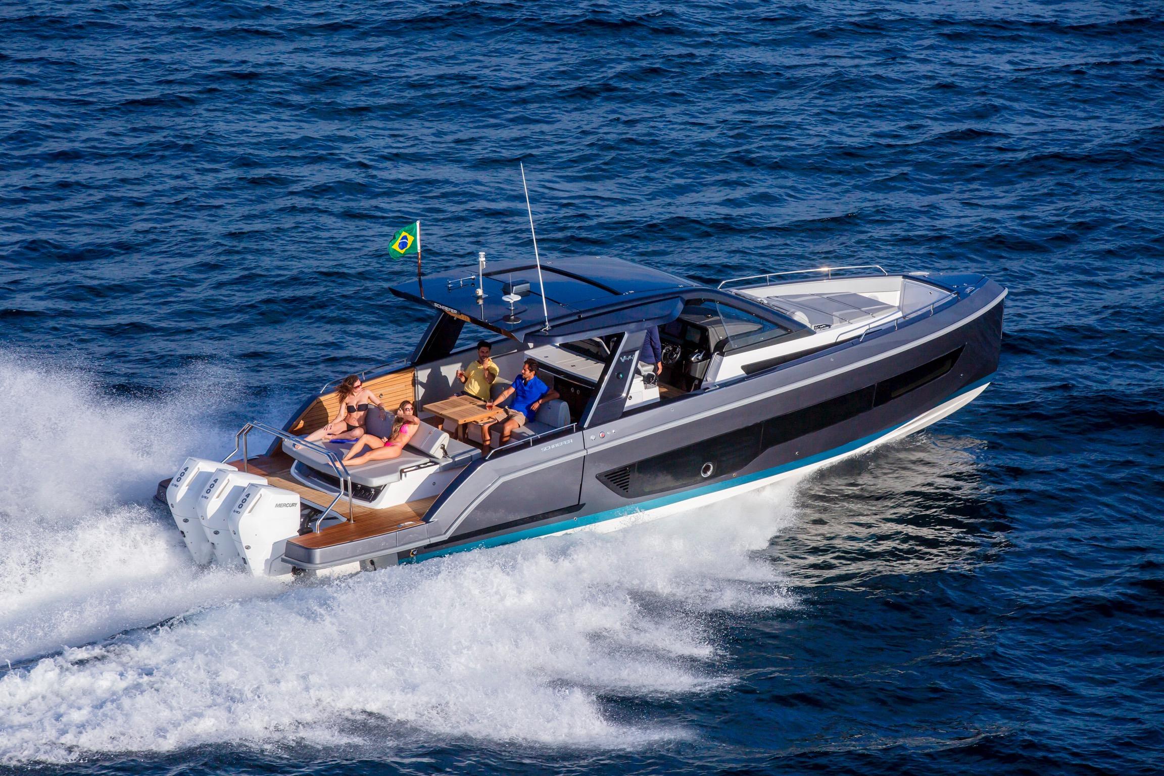2026 Schaefer Yachts V44 cruising on open water with passengers enjoying the ride.