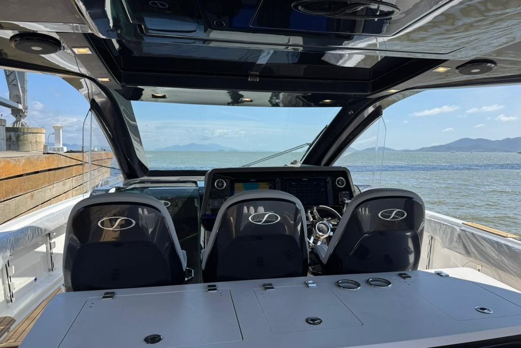 2026 Schaefer Yachts V44 cockpit with ocean view and modern controls.