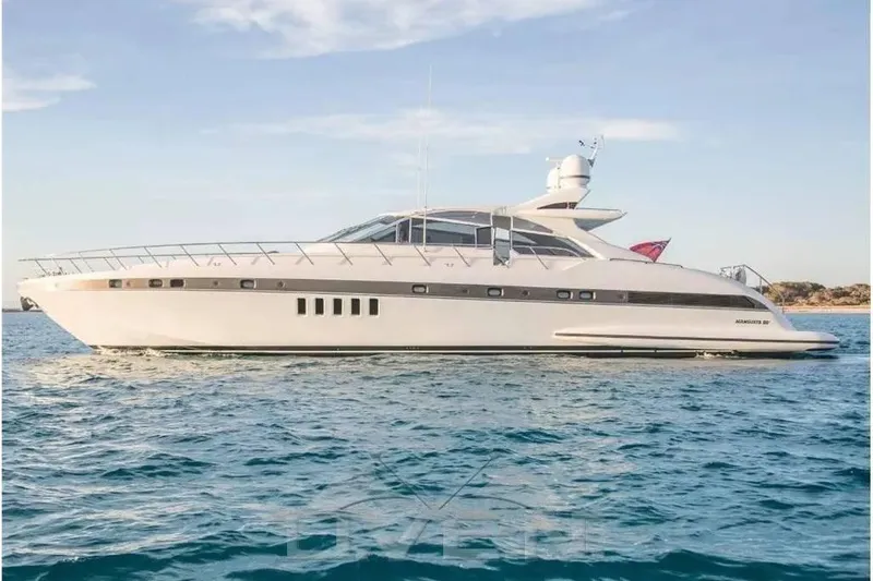  Yacht Photos Pics Luxury 2005 Mangusta 80 HT yacht cruising on open water.