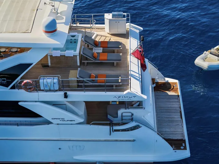 Silvia Yacht Photos Pics Luxurious 2018 Azimut Grande 30 Metri yacht with sun loungers on deck.