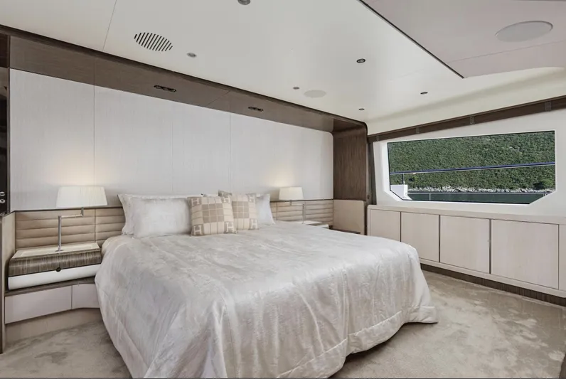 Silvia Yacht Photos Pics Luxurious bedroom interior on 2018 Azimut Grande 30 Metri yacht with large window view.