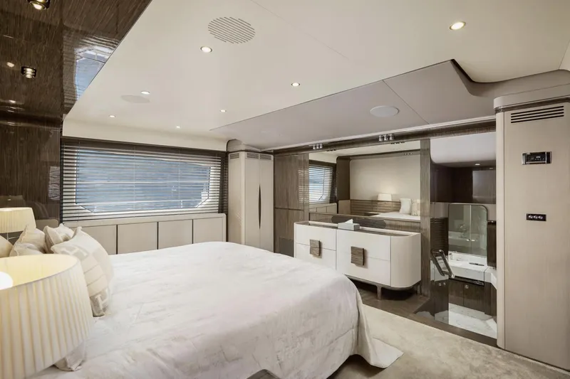 Silvia Yacht Photos Pics Luxurious bedroom interior of 2018 Azimut Grande 30 Metri yacht, featuring elegant design and modern amenities.