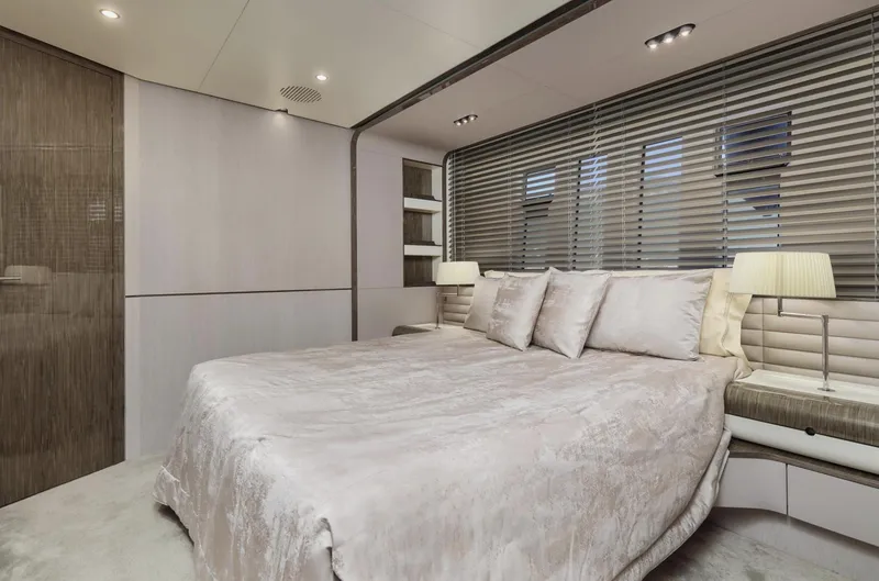 Silvia Yacht Photos Pics Luxurious bedroom interior on 2018 Azimut Grande 30 Metri yacht, featuring elegant design and modern amenities.