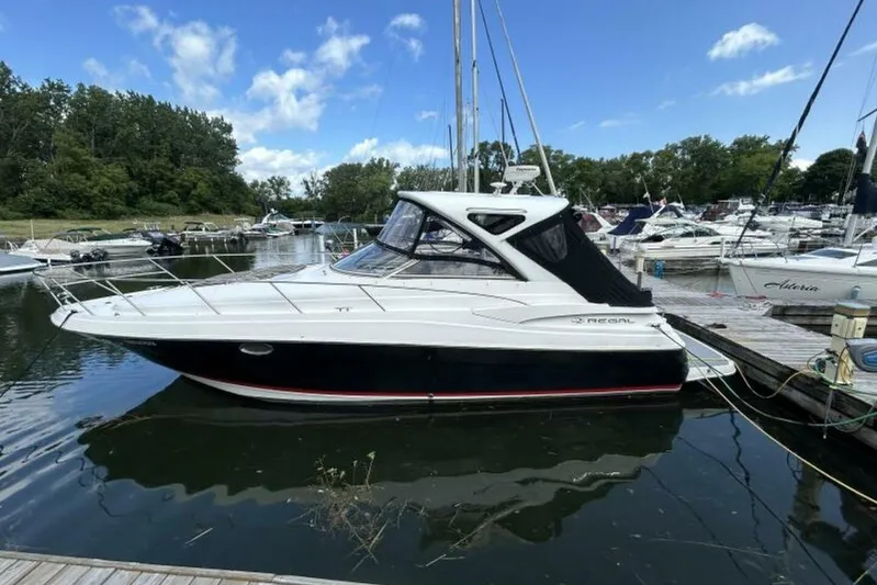  Yacht Photos Pics 2007 Regal 3760 Commodore yacht docked at a marina under a clear blue sky.