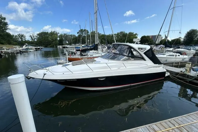  Yacht Photos Pics 2007 Regal 3760 Commodore yacht docked in a marina, surrounded by other boats.